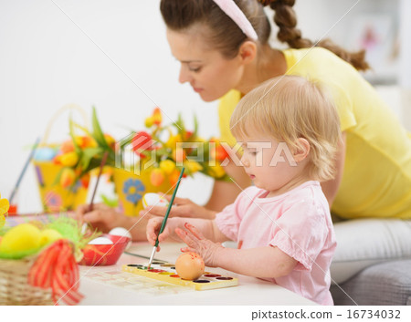 Mother and baby making Easter decorations Mother and baby making Easter decorations 16734032