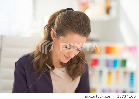 Fashion designer working in office 16734169