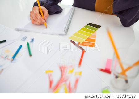 Closeup on fashion designer working in office Closeup on fashion designer working in office 16734188