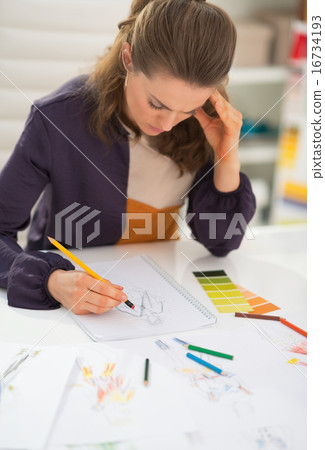 Fashion designer working in office Fashion designer working in office 16734193