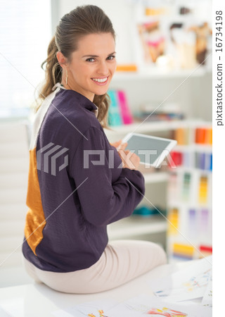Fashion designer working on tablet pc Fashion designer working on tablet pc 16734198