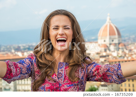 Happy young woman making selfie in front of panoramic view of fl Happy young woman making selfie in front of panoramic view of fl 16735209