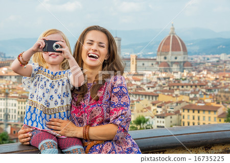 Happy mother and baby girl taking photo against panoramic view o Happy mother and baby girl taking photo against panoramic view o 16735225