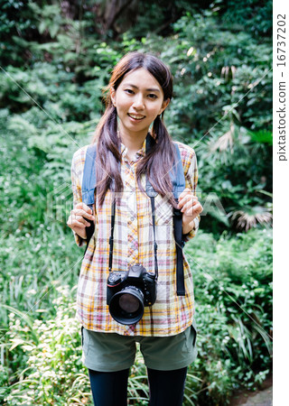 A woman trekking 16737202