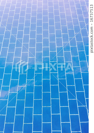 Blue tiled floor of a pool under clear water Blue tiled floor of a pool under clear water 16737513