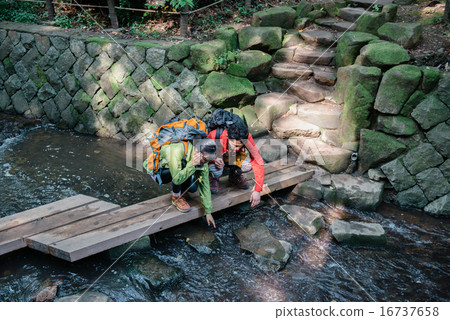 Men and women standing on the bridge Men and women standing on the bridge 16737658