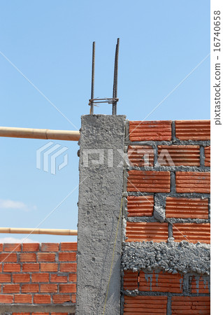 brick wall and pole house in residential building brick wall and pole house in residential building 16740658