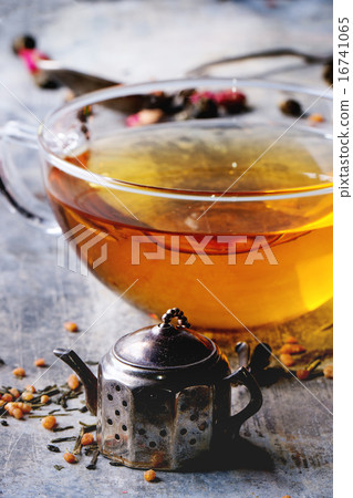 Cup of hot tea with tea strainer 16741065
