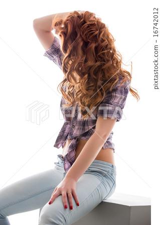 Curly red-haired girl in sexy casual clothing 16742012