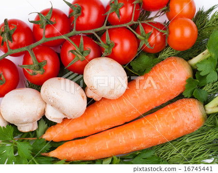 Carrots, mushrooms and tomatoes on greens 16745441