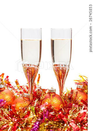 two glasses of champagne and gold Christmas bauble 16745853