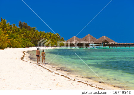 People on Maldives beach People on Maldives beach 16749548