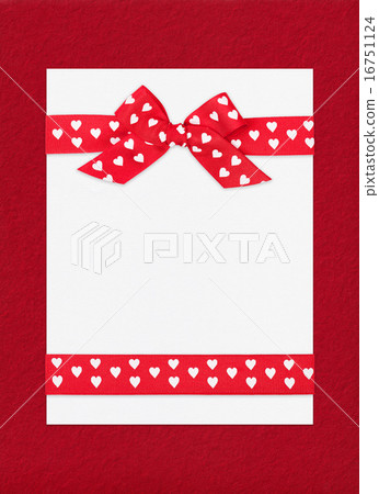 red bow on paper sheet red bow on paper sheet 16751124