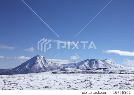 Sunny sky of South America Chilean superb view of Rikan Cabourg volcano in the Andes mountains seen from the snowy field of Atacama Highlands Sunny sky of South America Chilean superb view of Rikan Cabourg volcano in the Andes mountains seen from the snowy field of Atacama Highlands 16756561