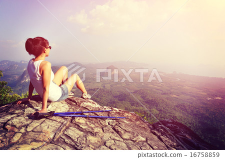 woman hiker enjoy the view at sunset mountain peak cliff woman hiker enjoy the view at sunset mountain peak cliff 16758859