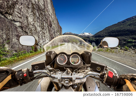 Biker First-person view, mountain serpentine. Biker First-person view, mountain serpentine. 16759806