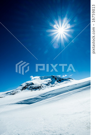 Sun and snowy mountain. Sun and snowy mountain. 16759813