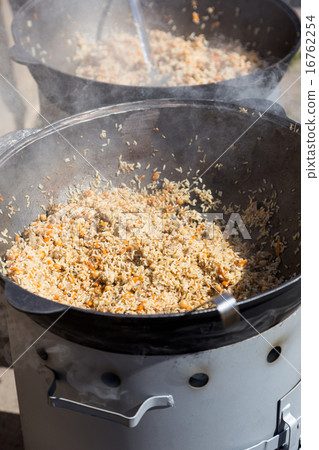 street food hot pilaw in cauldron on oven street food hot pilaw in cauldron on oven 16762254