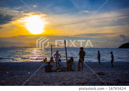 Beach Volleyball at sunset and pier 16765624