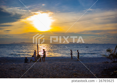 Beach Volleyball at sunset and pier 16765625