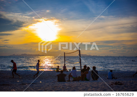 Beach Volleyball at sunset and pier 16765629