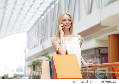 Shopping woman talking on the phone Shopping woman talking on the phone 16766038