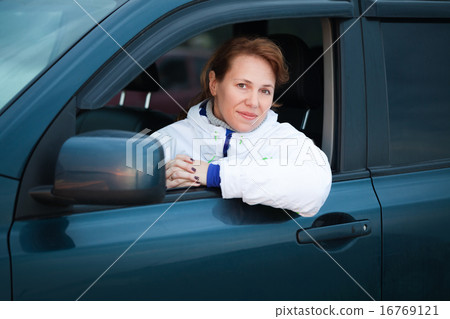 Young Caucasian woman as a driver in a big car Young Caucasian woman as a driver in a big car 16769121