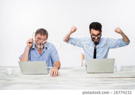 The two colleagues working together at office on white background 16774232