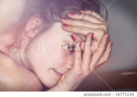 close up portrait of a beautiful young woman 16775139