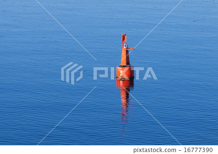 Red modern navigation buoy on still water Red modern navigation buoy on still water 16777390