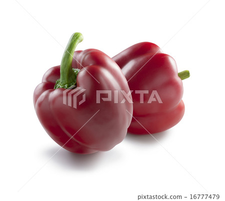 2 perfect red bell peppers isolated on white 16777479