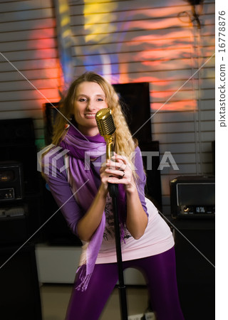 Pretty woman singing at concert Pretty woman singing at concert 16778876