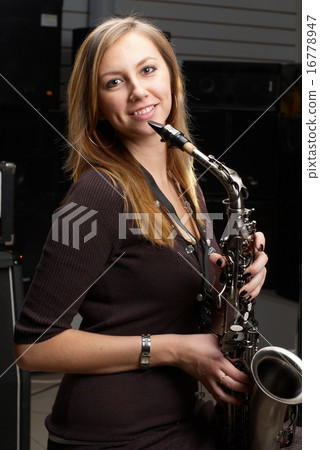 Pretty woman with saxophone Pretty woman with saxophone 16778947