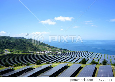 Power plant where wind turbines for wind power generation and solar panels line up Power plant where wind turbines for wind power generation and solar panels line up 16779244