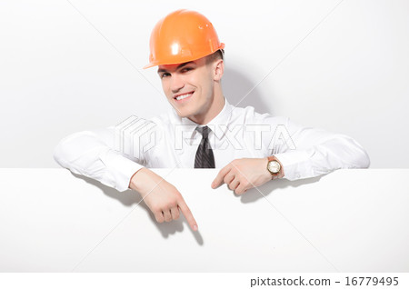 Foreman pointing down behind white board  16779495