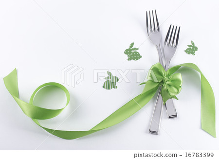Two forks with green bunnies and ribbon Two forks with green bunnies and ribbon 16783399