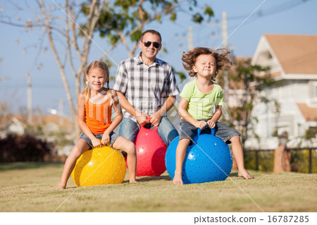 Dad and children playing on the lawn Dad and children playing on the lawn 16787285