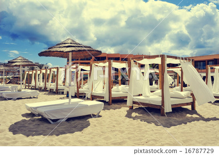 beds and loungers in a beach club in Ibiza, Spain 16787729