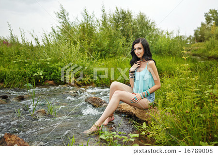 Boho Girl sitting barefoot on the beach. - Stock Photo [16789008] - PIXTA