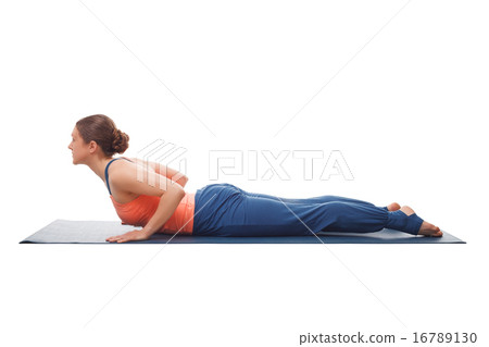Sporty fit yogini woman practices yoga asana bhujangasana Sporty fit yogini woman practices yoga asana bhujangasana 16789130