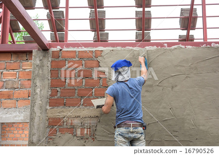 Builder worker plastering concrete at wall Builder worker plastering concrete at wall 16790526