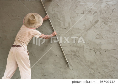 Builder worker plastering  concrete at wall 16790532