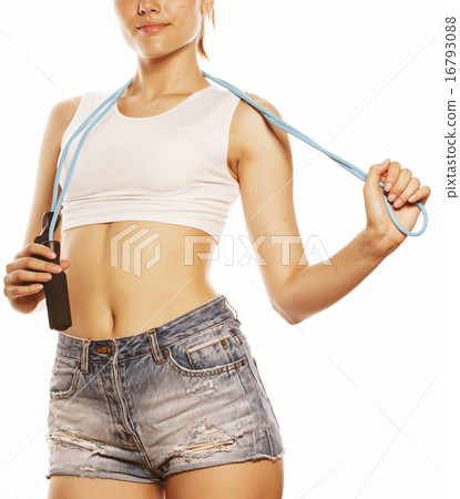 young pretty woman with skipping rope isolated on white young pretty woman with skipping rope isolated on white 16793088