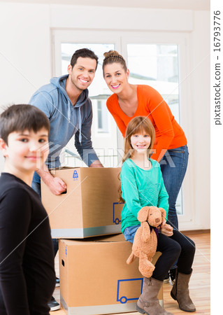 Family with moving boxes in new home Family with moving boxes in new home 16793776
