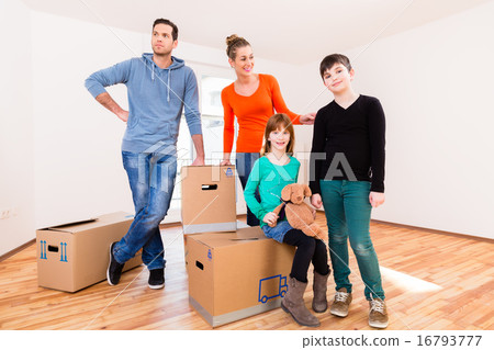 Family with moving boxes in new home 16793777