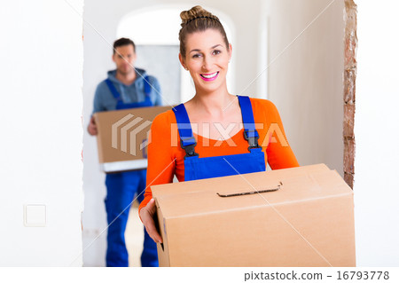 Woman and man moving in new home with boxes Woman and man moving in new home with boxes 16793778
