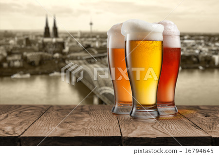 Glass of beer with view of Koeln on background 16794645