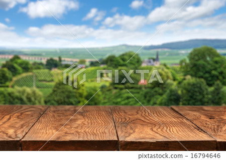 wooden table with vineyard landscape 16794646