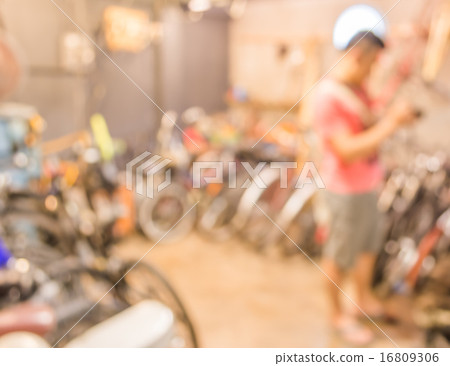 blurred image of lots of parked bikes. Useful as background 16809306