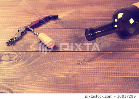Bottle of red wine and corks. 16817299